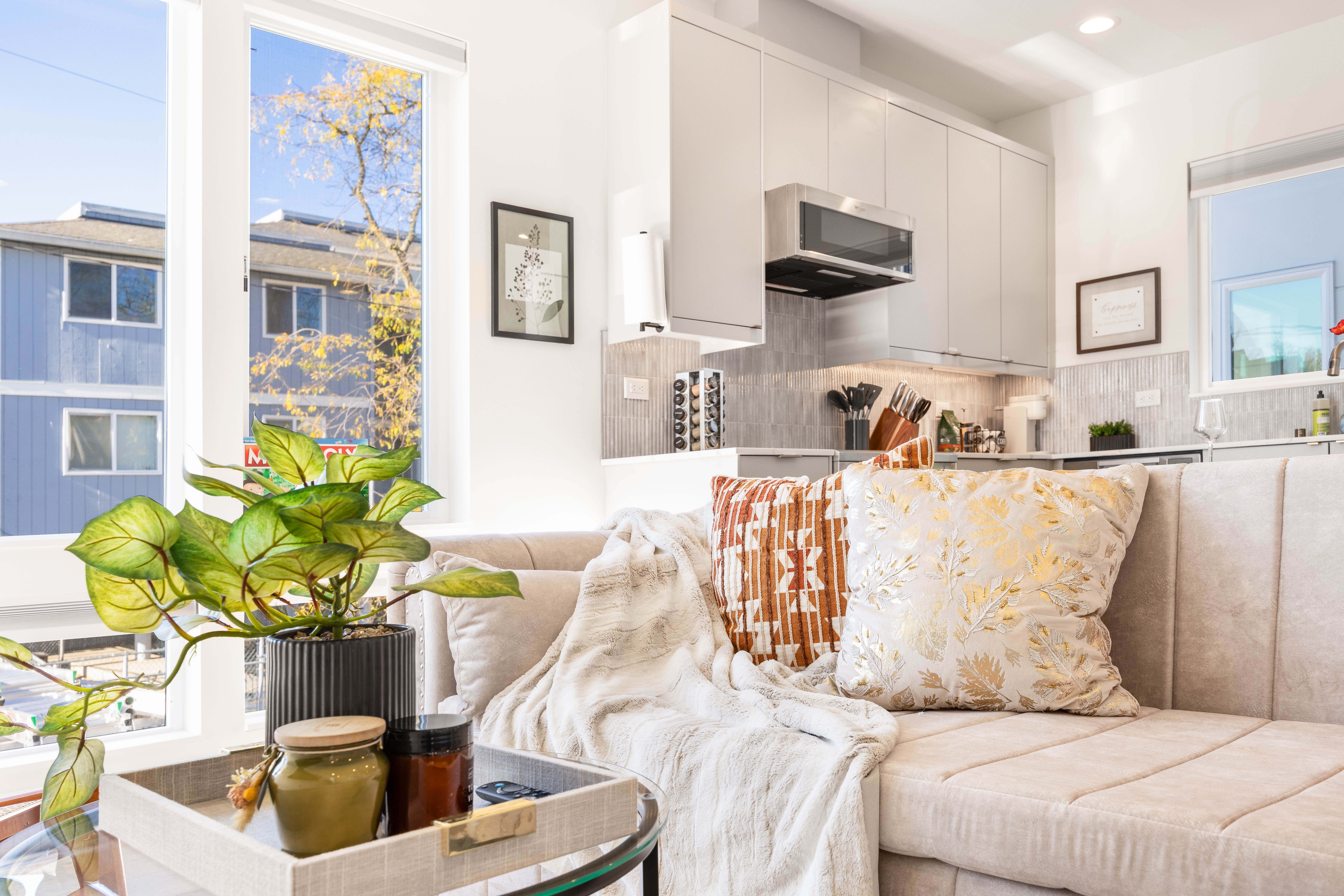 Open-plan living room with L-shaped sofa and designer interiors