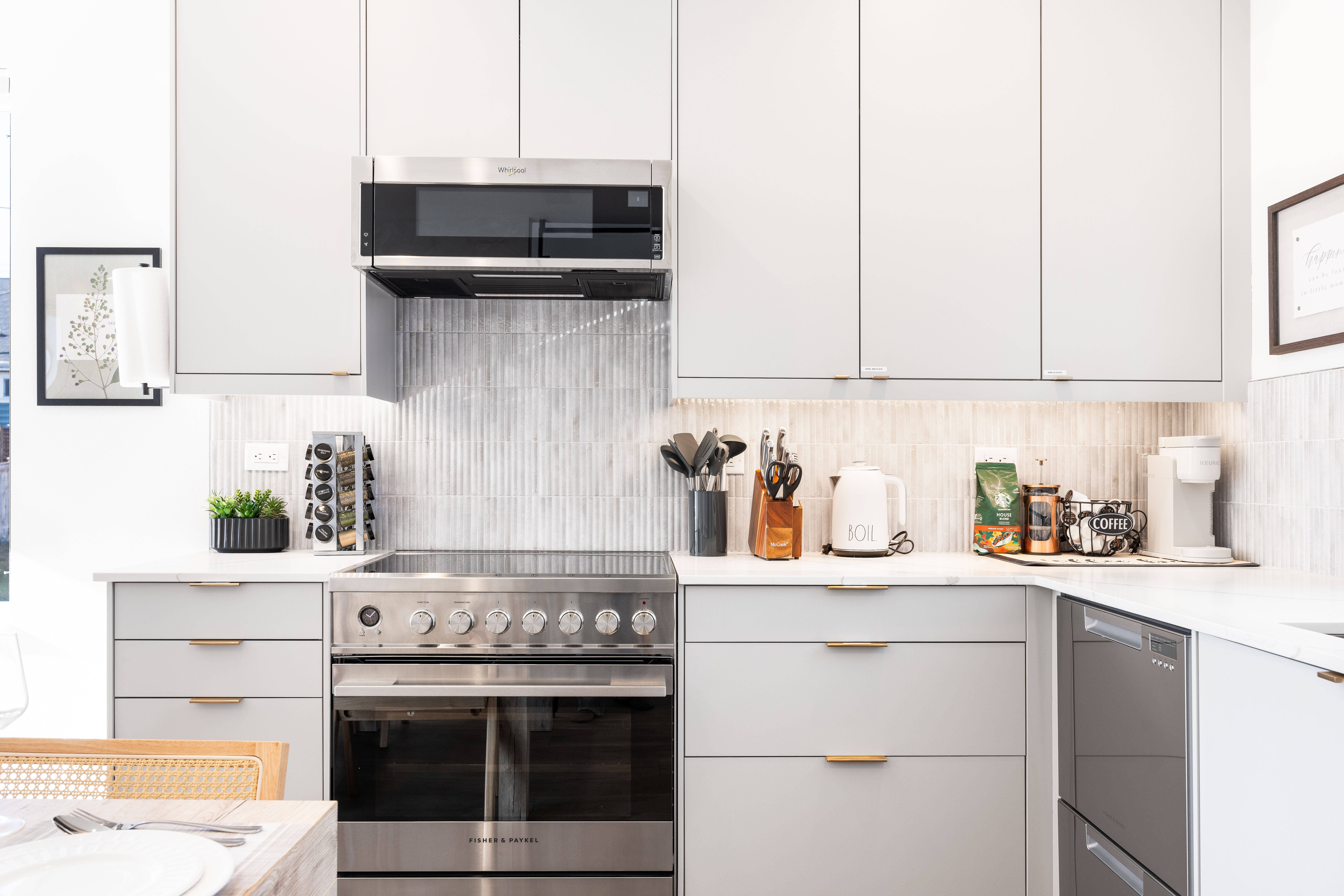 Full modern kitchen with stainless appliances and dining table for 6